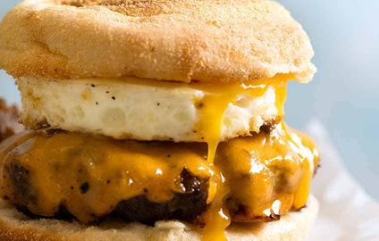 Close up of homemade Sausage and Egg McMuffin, ready to be eaten