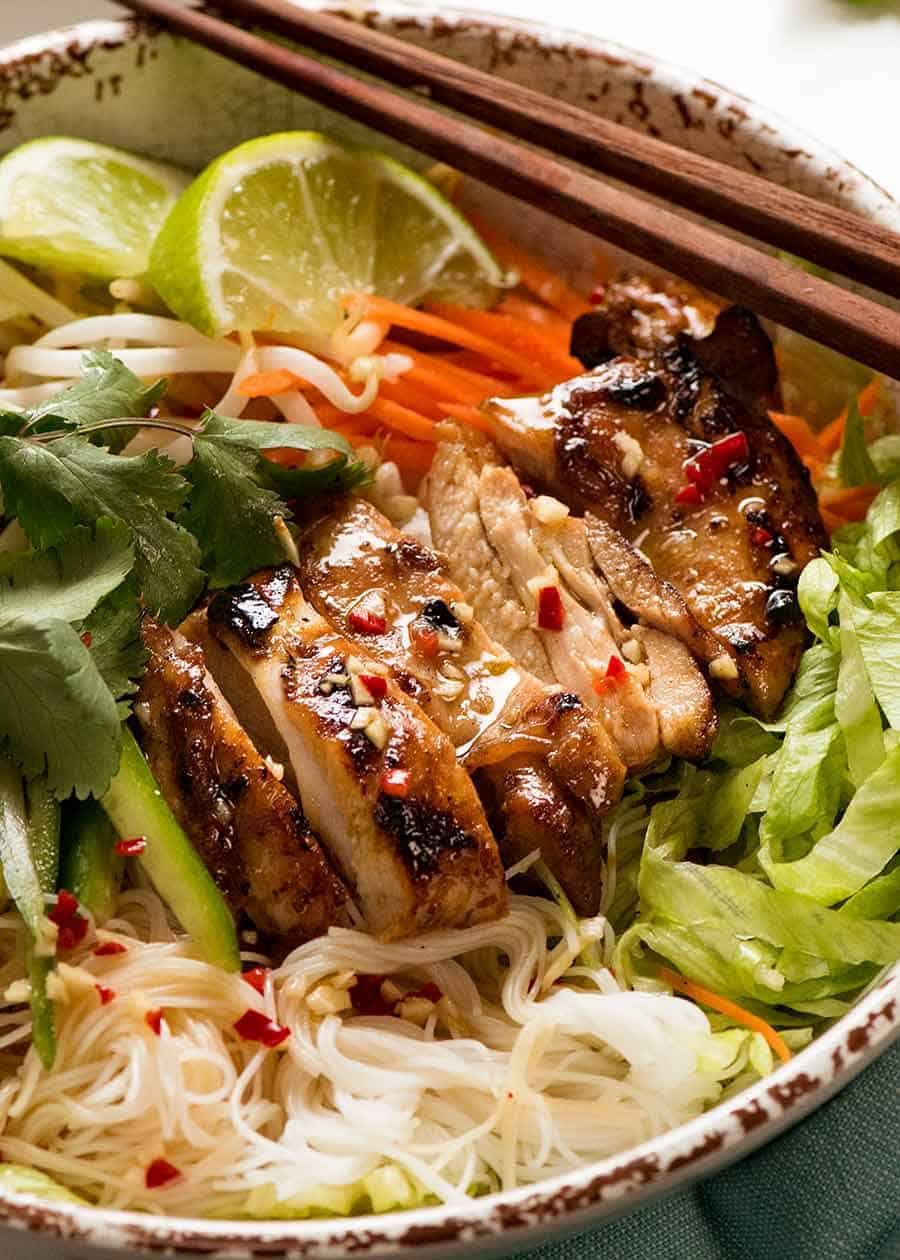 Close up of Vietnamese Noodles with Lemongrass marinated chicken in a bowl, ready to be eaten