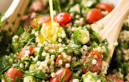This Israeli Couscous Salad is fabulously addictive! Tender, flavour infused beads of couscous tossed with spinach, tomato, cucumber, herbs and a fresh lemon dressing. Summer in a bowl! recipetineats.com