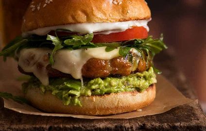 Close up of juicy, flavour loaded Avocado Chicken Burgers, ready to be eaten