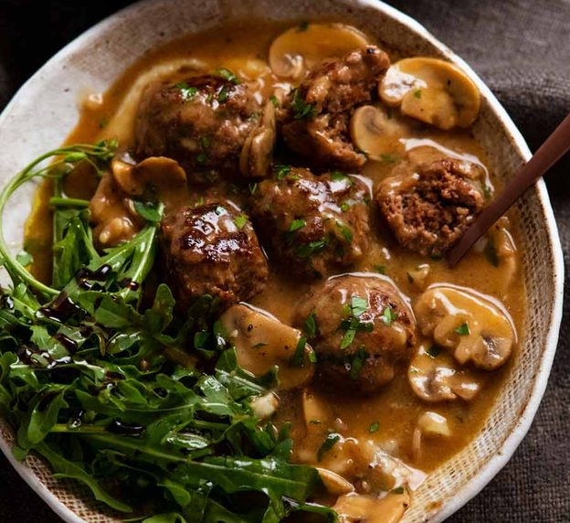 Salisbury steak meatballs served over mashed potato